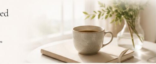 A journal and warm drink in a calm, sunlit setting
